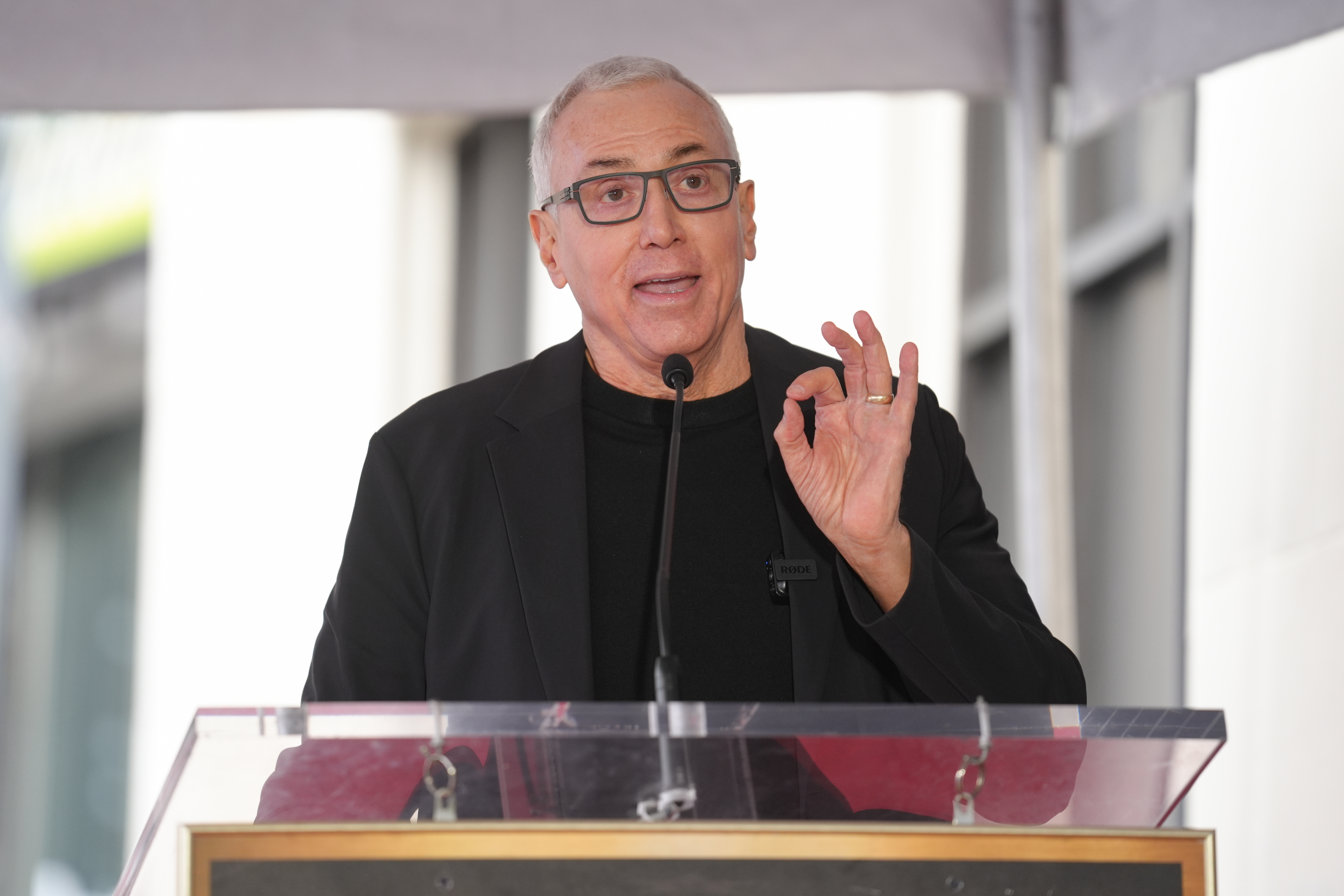 Drew Pinsky speaks during a ceremony honoring Adam Carolla with...