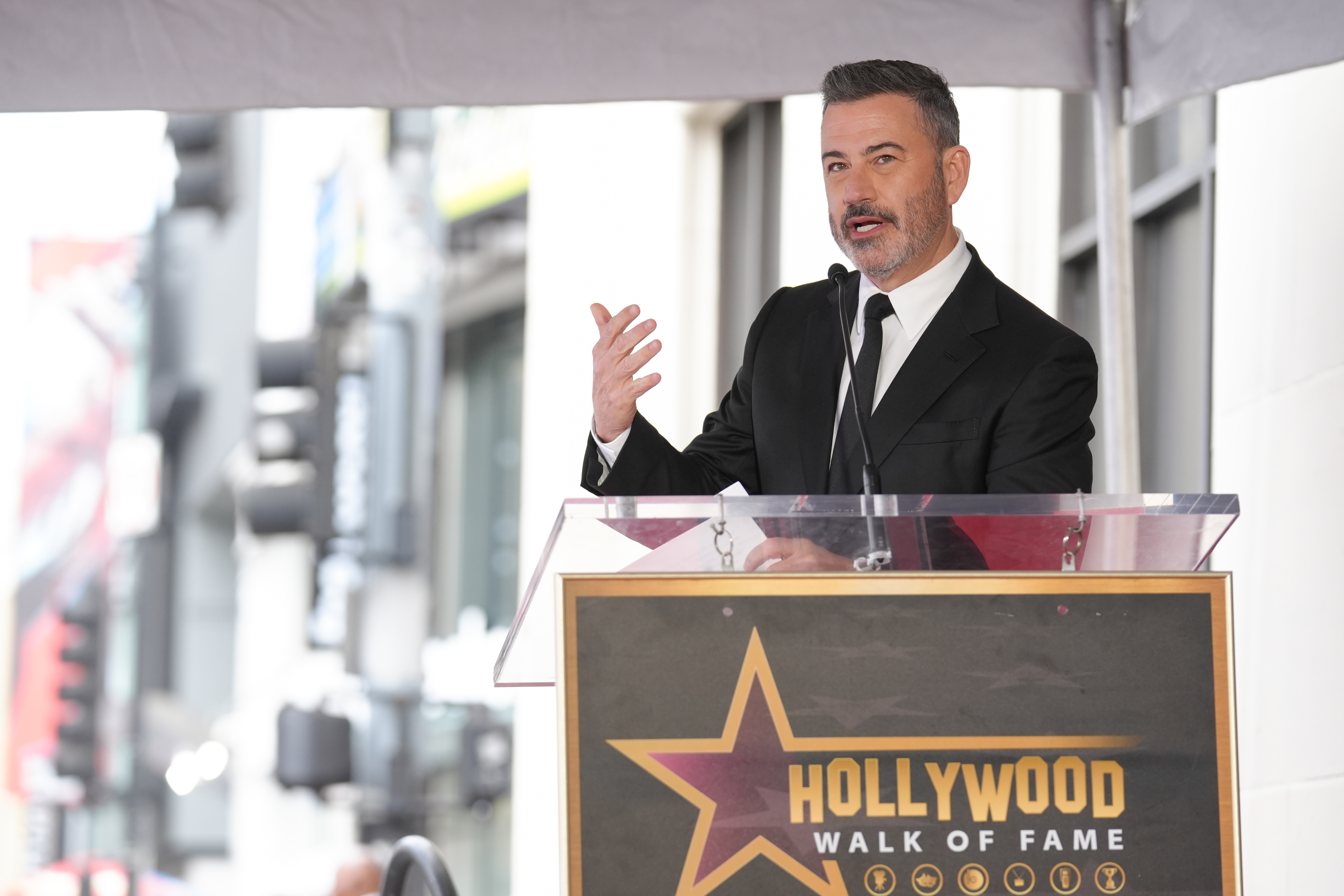 Jimmy Kimmel speaks during a ceremony honoring Adam Carolla with...