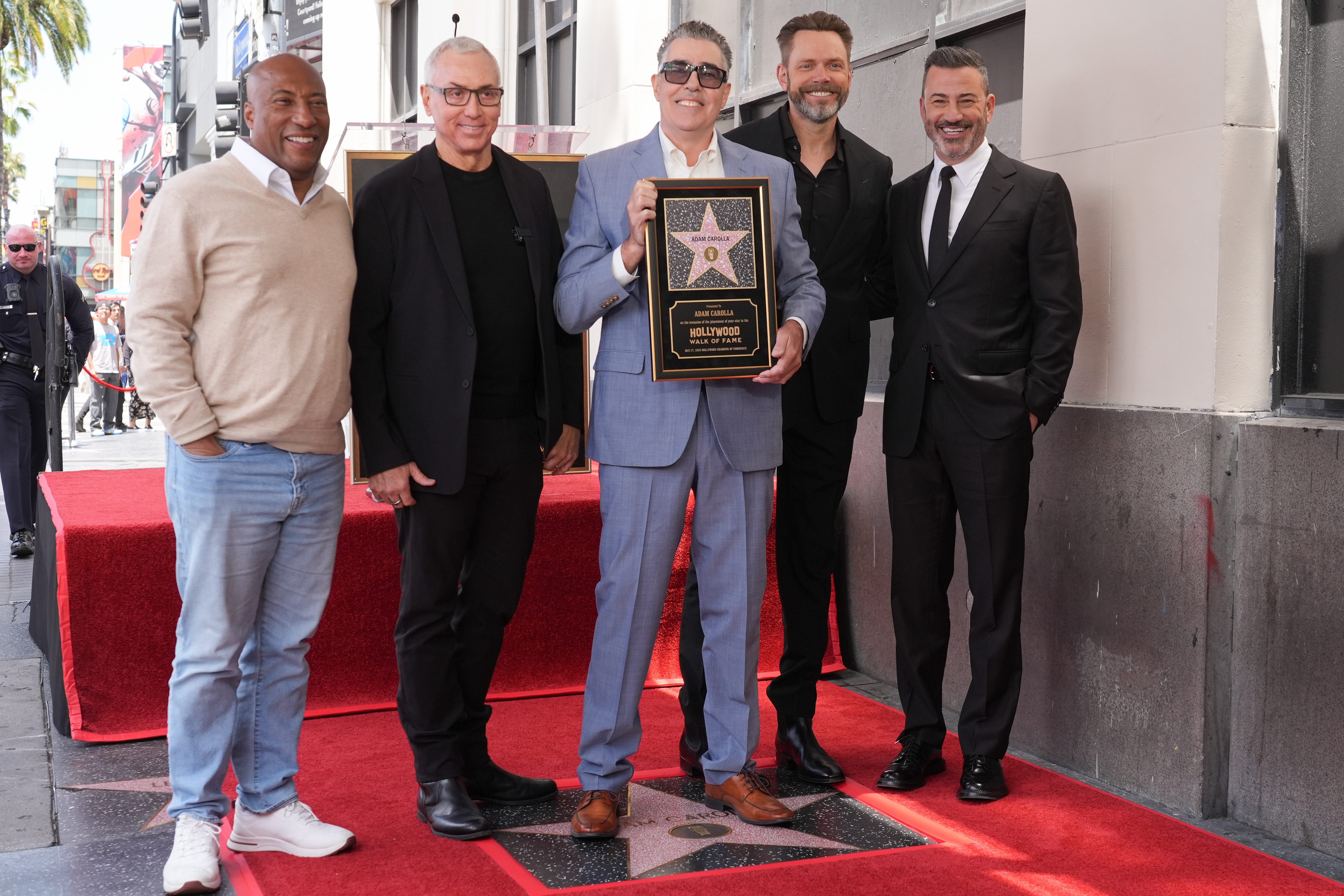 Byron Allen, from left, Drew Pinsky, Adam Carolla, Joel McHale,...