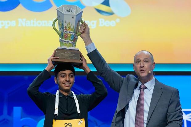 E.W. Scripps Company president and CEO Adam Symson, right, holds the trophy over winner of the 2026 Scripps National Spelling Bee, Shrey Parikh, 14, of Rancho Cucamonga, Calif., at DAR Constitution Hall, Thursday, May 28, 2026, in Washington. (AP Photo/Jose Luis Magana)