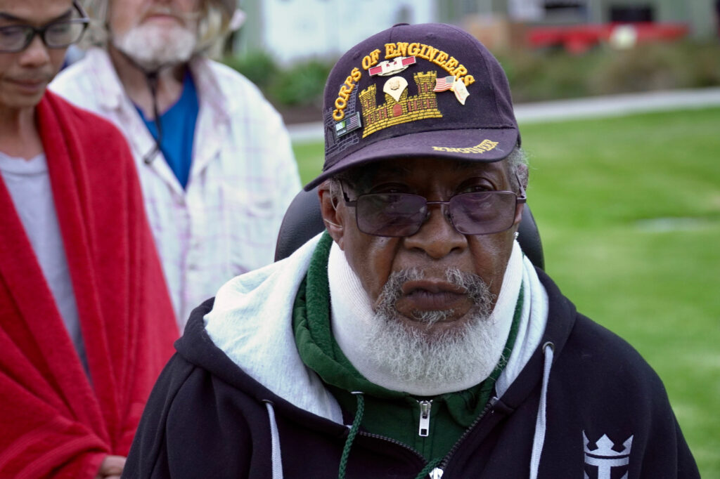 Ronald Fritzgerald, a 76-year-old U.S. Army Corps of Engineers veteran who was forced to evacuate, waits for food at a shelter in Fountain Valley on May 23. Credit: Steven Rodas/Inside Climate News