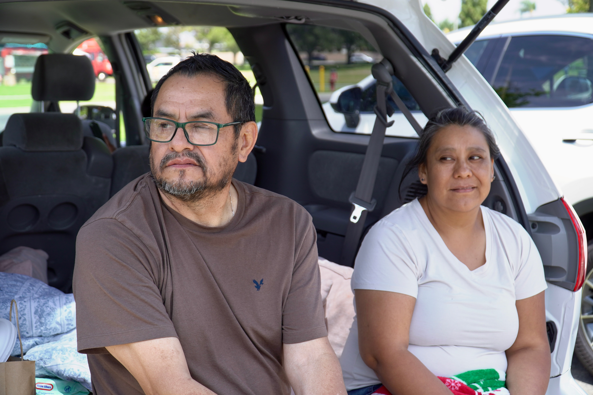 Noe Manjarrez and Elizabeth Manjarrez were forced to evacuate with both of their children. Credit: Steven Rodas/Inside Climate News