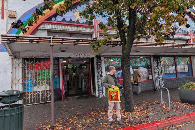 A shopper stands in front of Amoeba Music