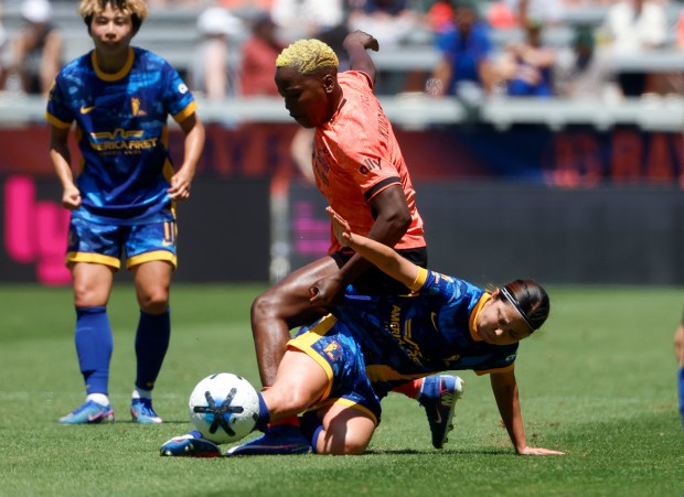 Bay FC's Racheal Kundananji (9) fights for the ball against Utah Royals FC's Narumi Muria (10) in the first half at PayPal Park in San Jose, Calif., on Sunday, May 10, 2026. (Nhat V. Meyer/Bay Area News Group)