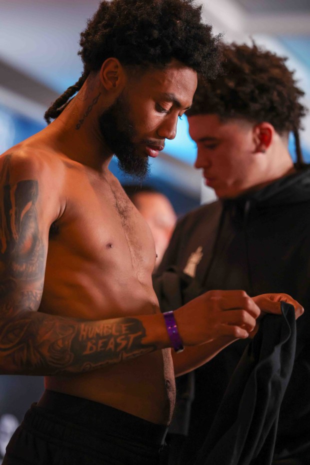 Amari Jones, of Oakland, left, puts his t-shirt on after an official weigh-in ahead of his fight against Vincenzo Gualtieri, of Germany, at the Hayes Mansion in San Jose, Calif., Thursday, May 21, 2026. Jones, an undefeated middleweight contender, and Gualtieri, a former IBF middleweight world champion, will fight in a 12-round IBF title eliminator bout on Friday at the SAP Center in San Jose. (Ray Chavez/Bay Area News Group)