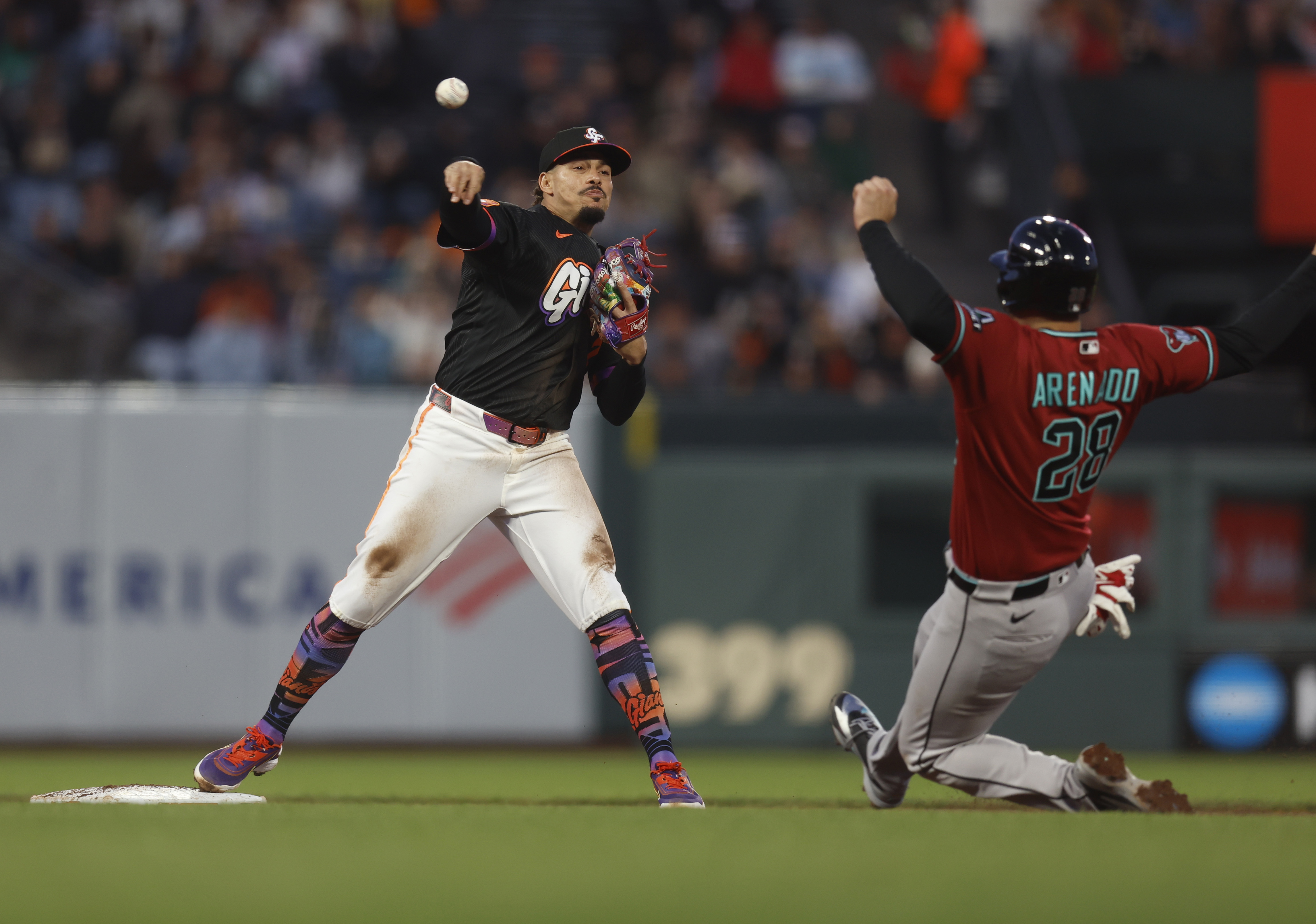 San Francisco Giants’ Willy Adames (2) throws to first base...