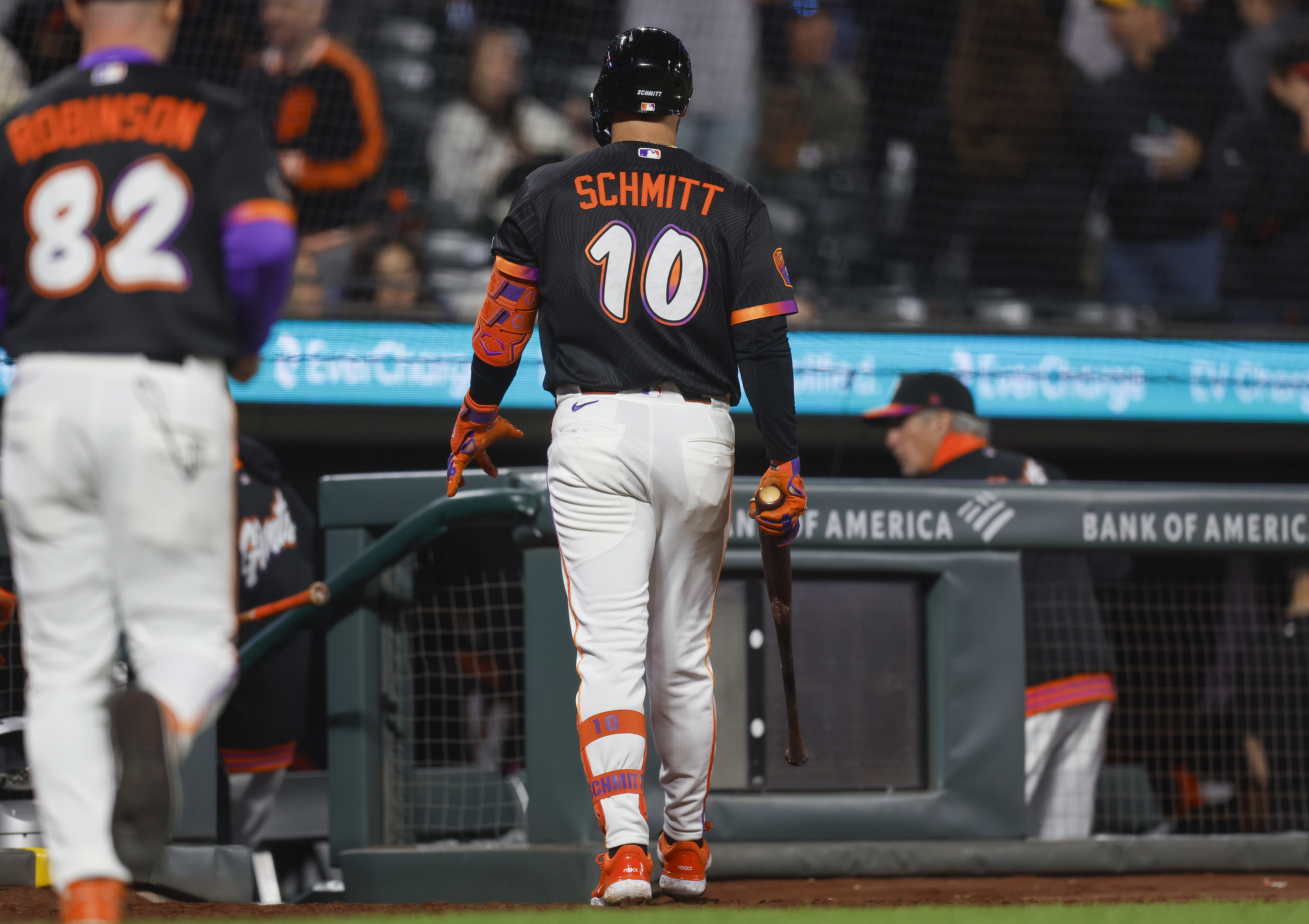 San Francisco Giants’ Casey Schmitt (10) heads to the dugout...