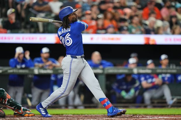 Toronto Blue Jays' Charles McAdoo, during his MLB debut, hits a two-run home run during the seventh inning of a baseball game against the Baltimore Orioles, Friday, May 29, 2026, in Baltimore. (AP Photo/Stephanie Scarbrough)