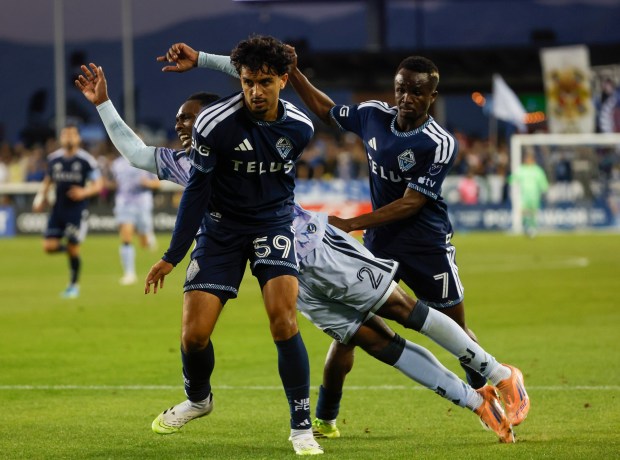 San Jose Earthquakes' Jamar Ricketts (2) falls while running with the ball against Vancouver Whitecaps' Jeevan Badwal (59) and Vancouver Whitecaps' Cheick Sabaly (7) during the first half at PayPal Park in San Jose, Calif., on Saturday, May 9, 2026.  (Shae Hammond/Bay Area News Group)