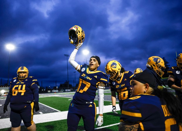 Golden State Storm's Lex Contreras (17) raises her helmet towards fans in celebration during a game against the Oregon Ravens at Laney College in Oakland, Calif., on Sunday, May 3, 2026. (Shae Hammond/Bay Area News Group)