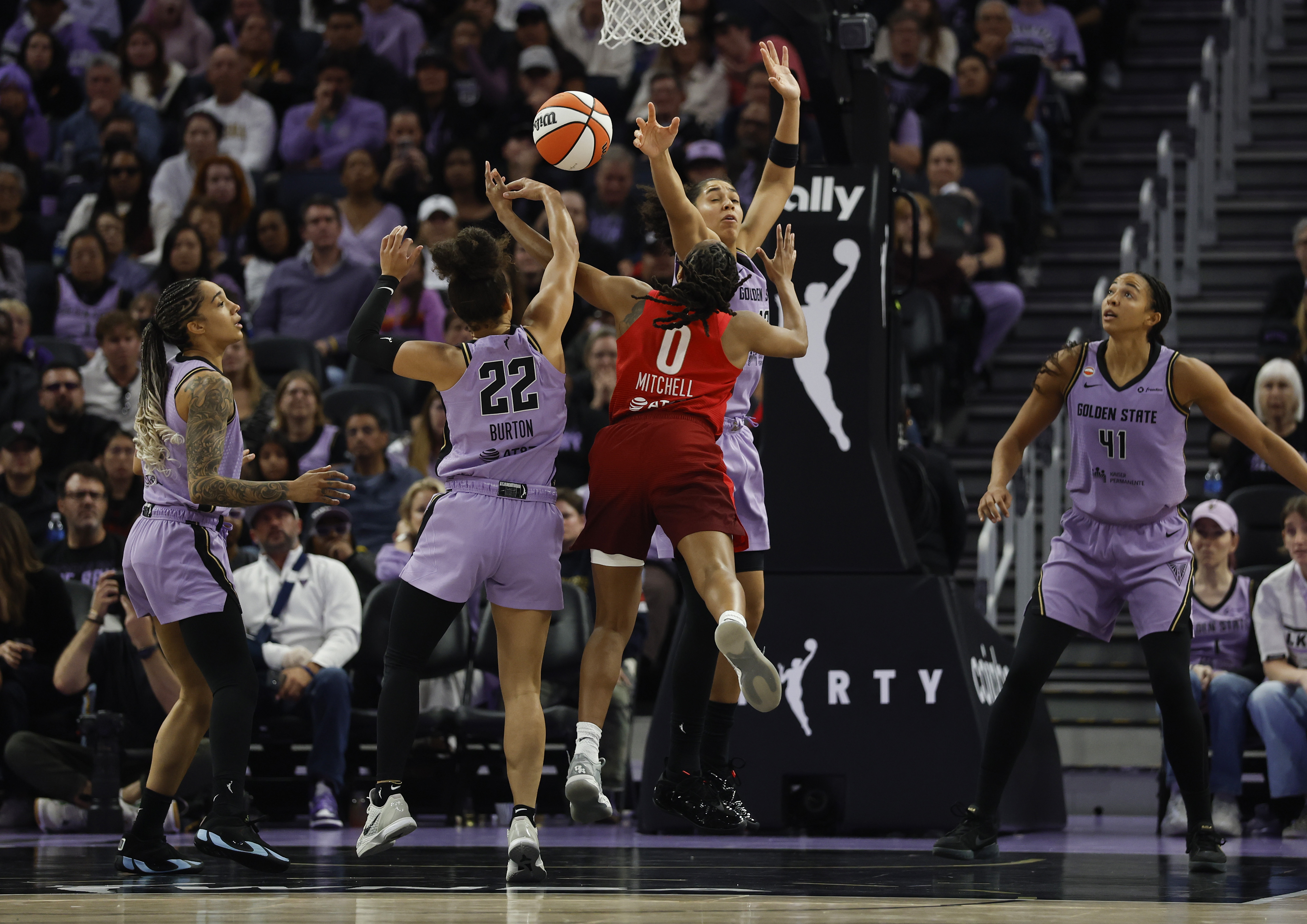 Golden State Valkyries' Veronica Burton (22) defends against Indiana Fever's...