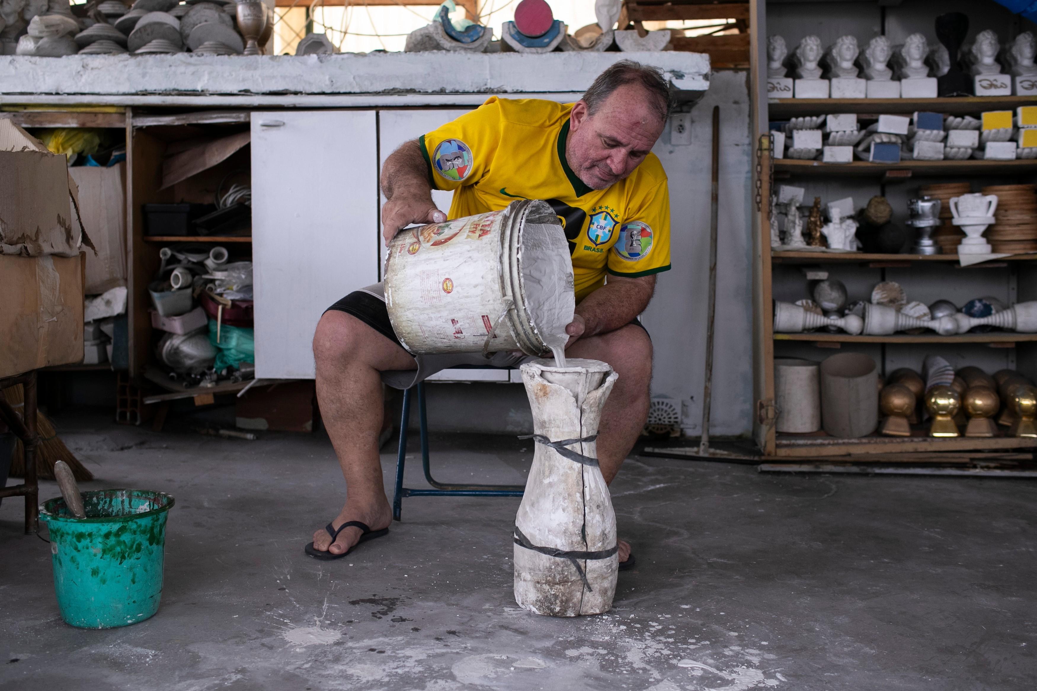 Jarbas Meneghini Carlini demonstrates how he makes FIFA World Cup trophy replicas.
