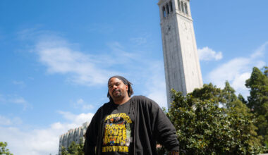 Charles Long looks at the camera, with the UC Berkeley campanile in the background.