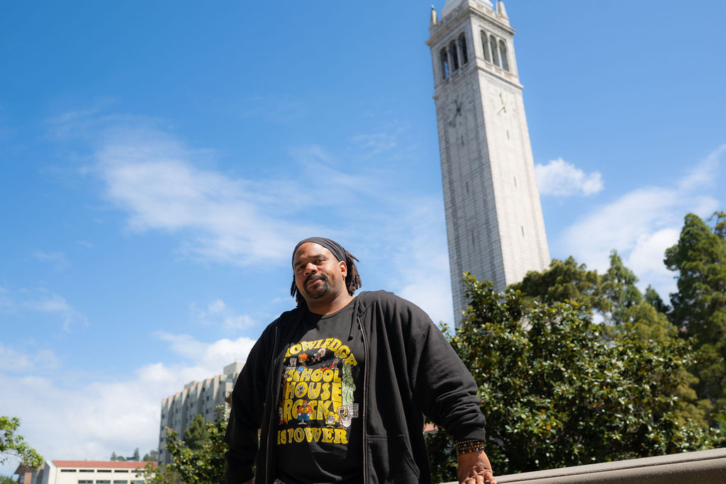 Charles Long looks at the camera, with the UC Berkeley campanile in the background.