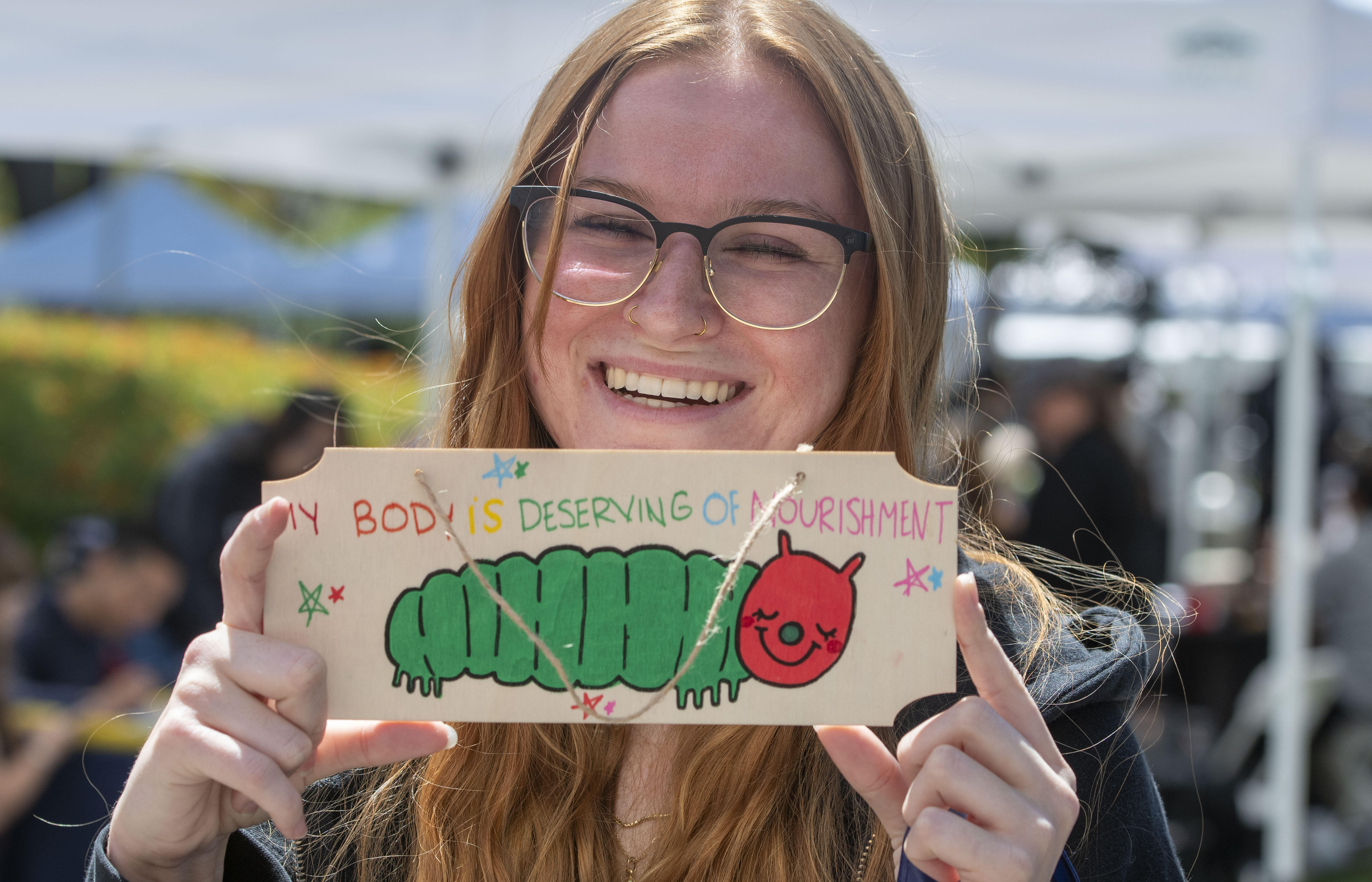One student shows off her free affirmation Tuesday in the...