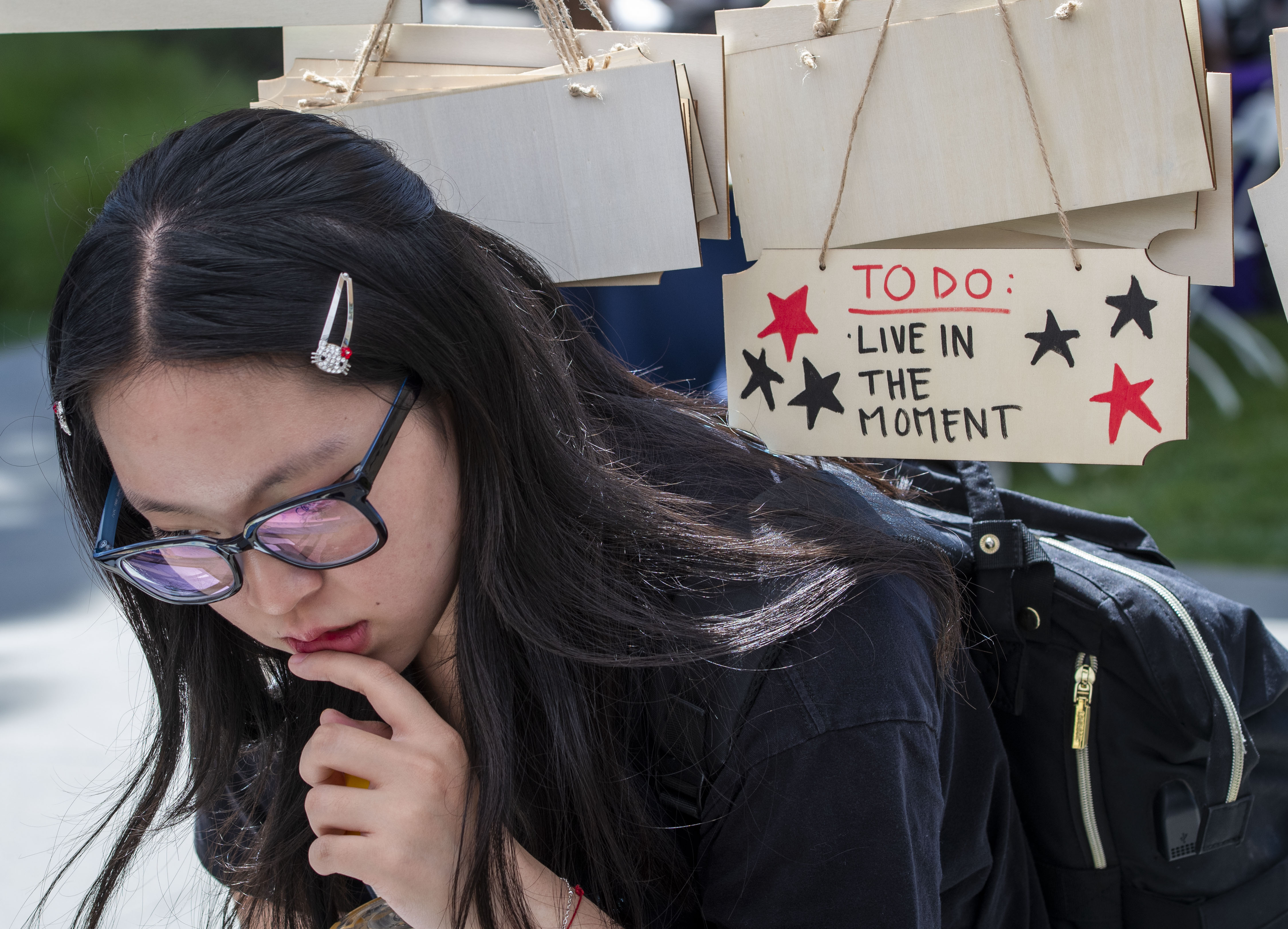 CSUF student Rebecca Paek tries to decide which affirmation to...
