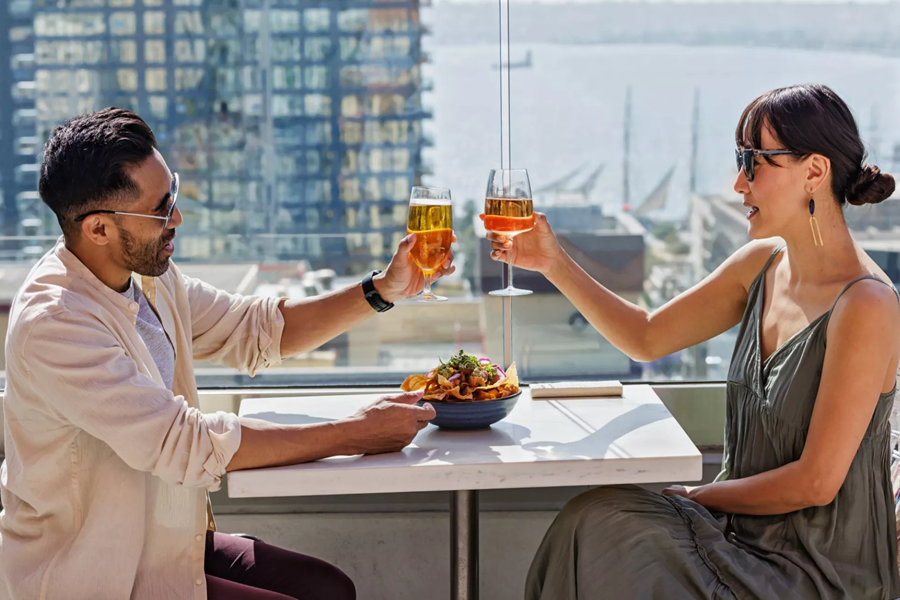 Guests enjoying drinks on The Rooftop at Carté Hotel San Diego