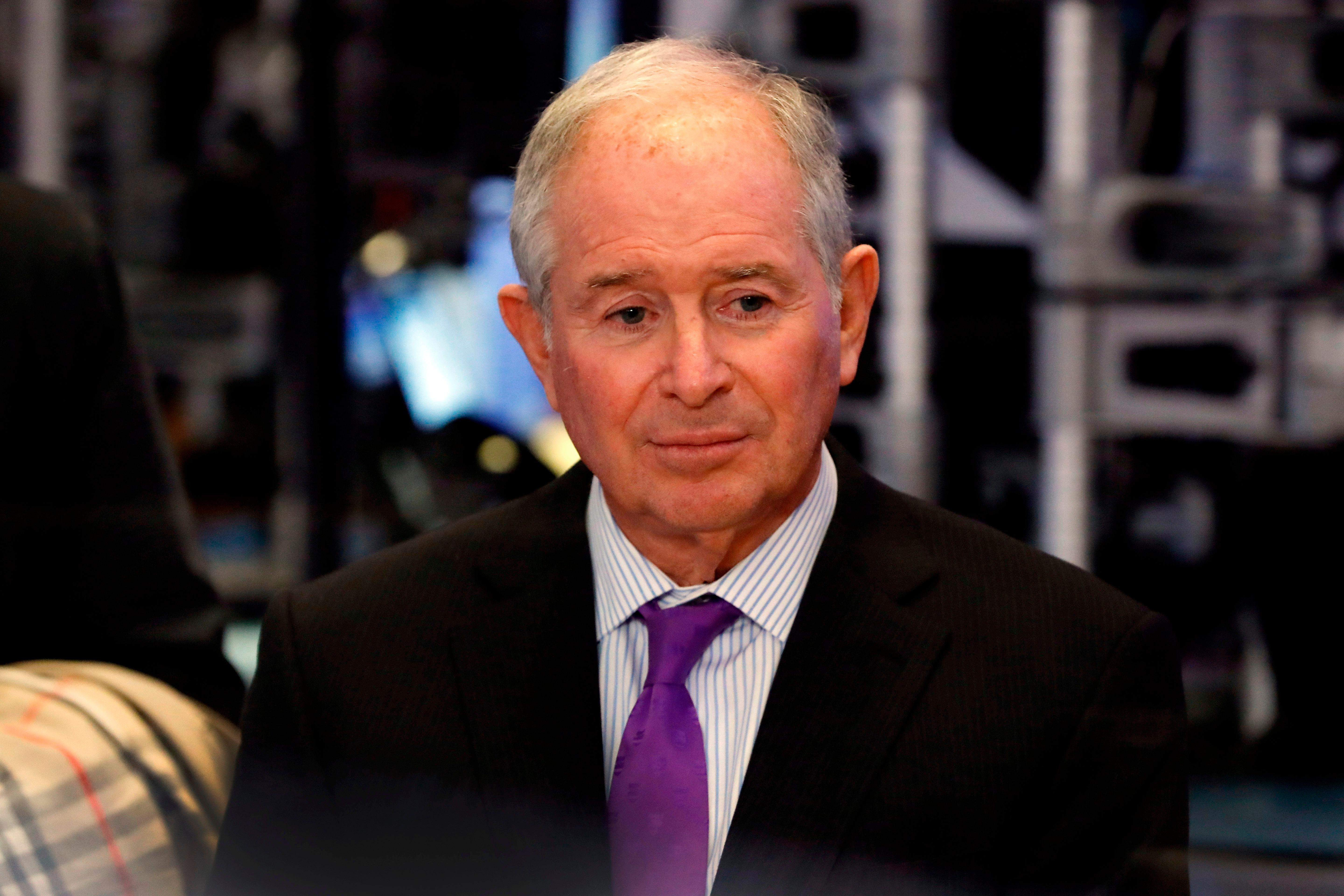 Stephen Schwarzman waits to be interviewed on the floor of the New York Stock Exchange.