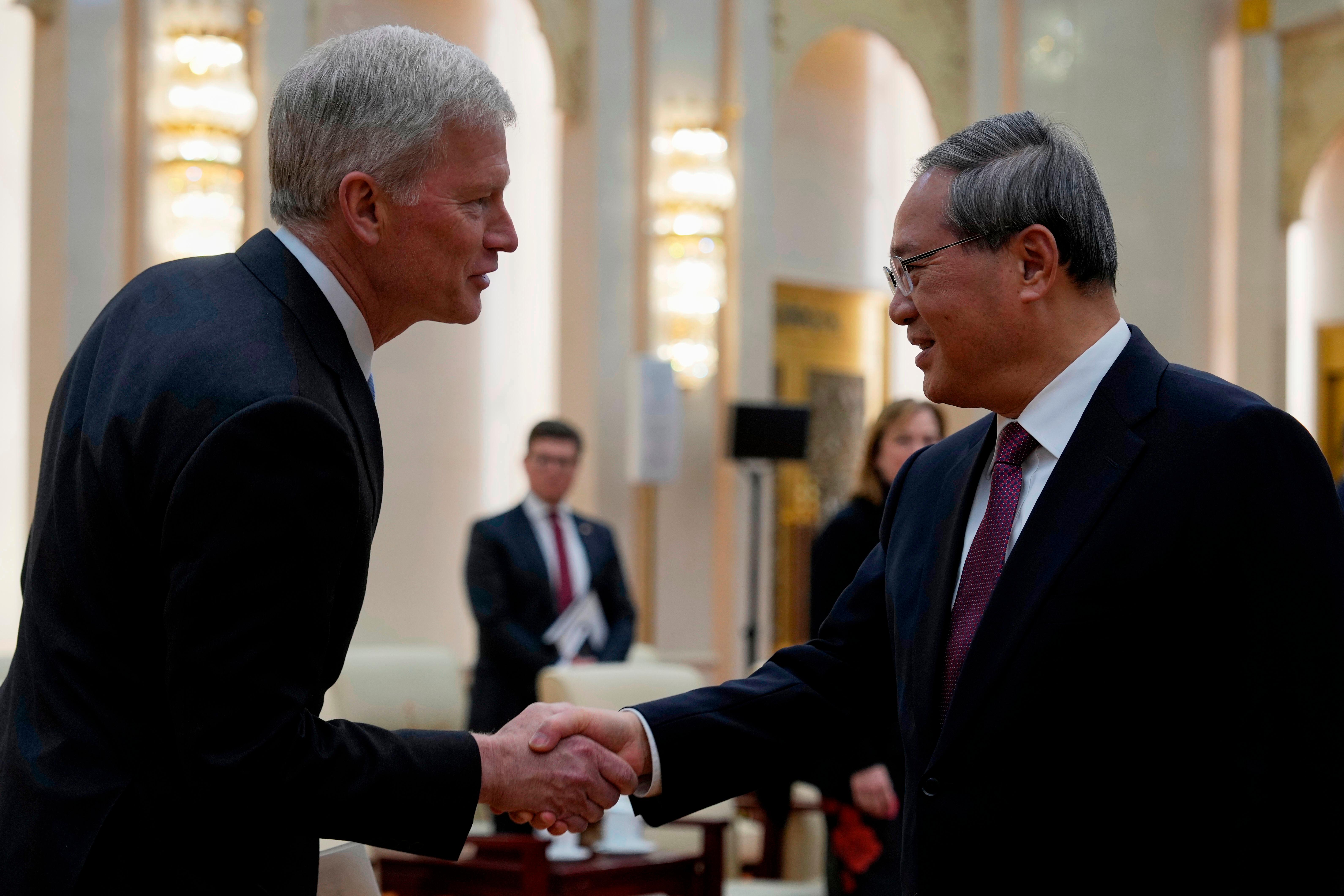 Chinese Premier Li Qiang greets Cargill CEO Brian Sikes.