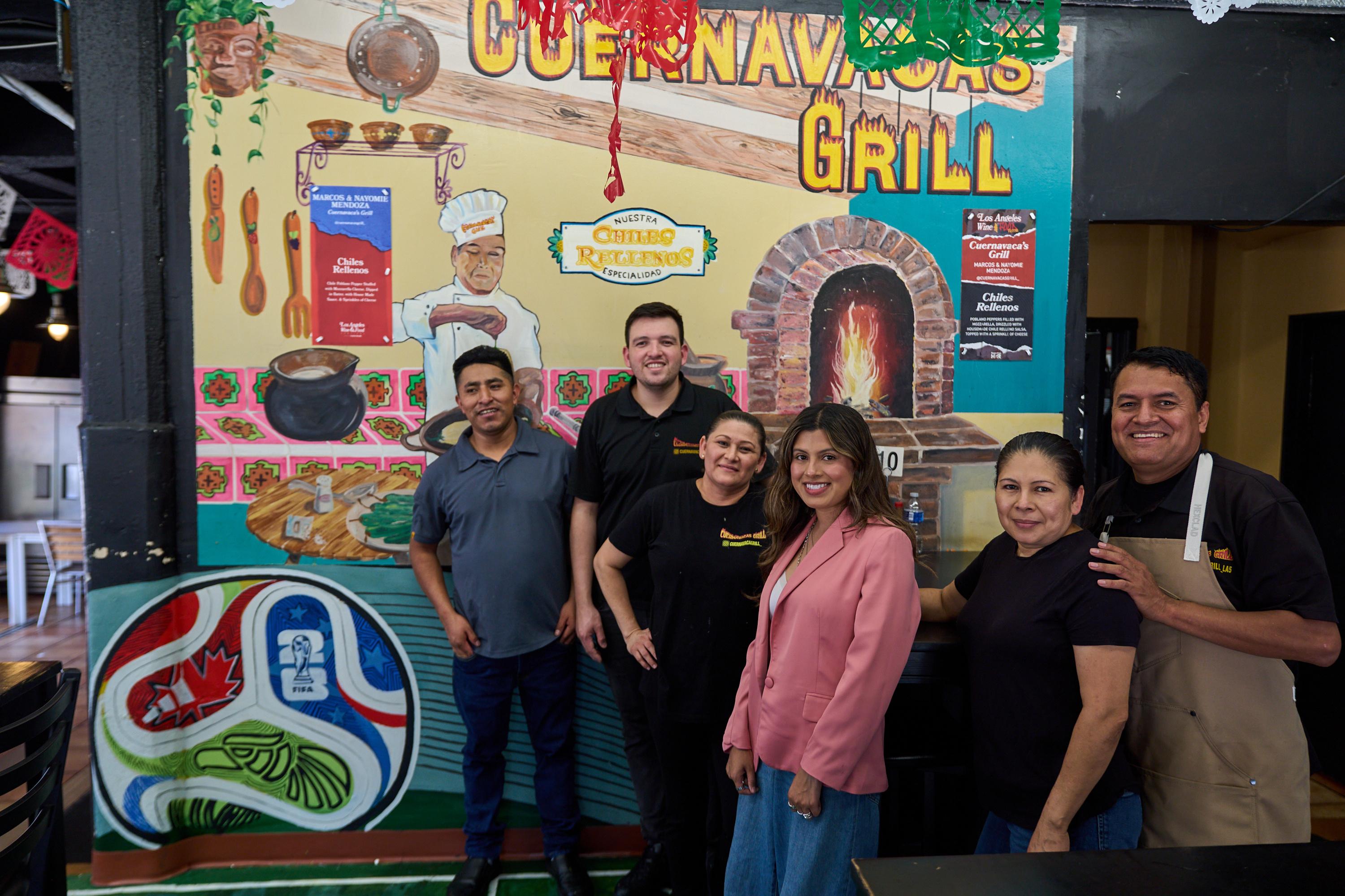 Owners and staff of Cuernavaca Grill pose for a photo in Los Angeles.