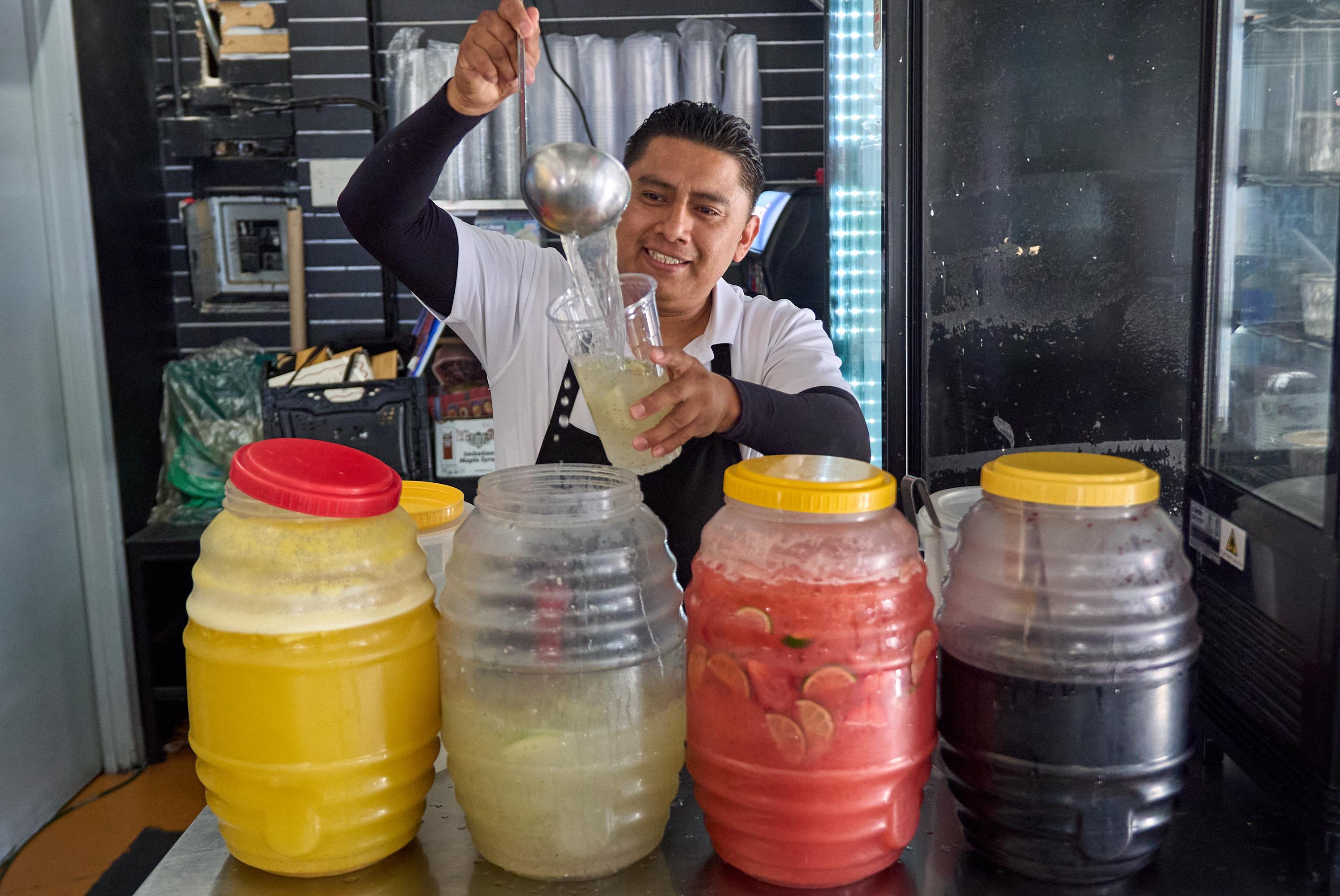 Waiter Usiel Macias serves a lemonade at Cuernavaca's Grill in downtown Los Angeles.