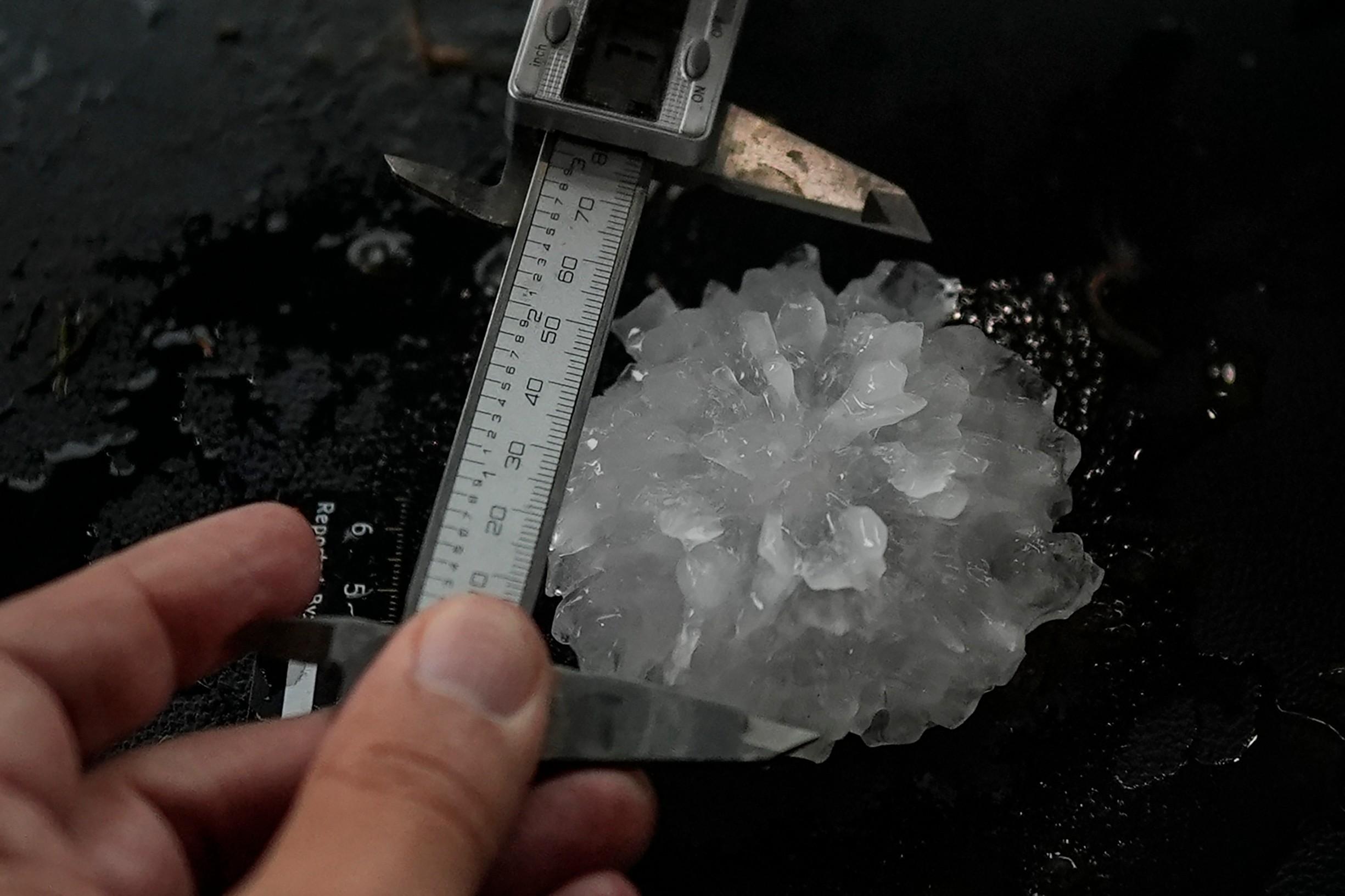 Tim Marshall measures a large hail