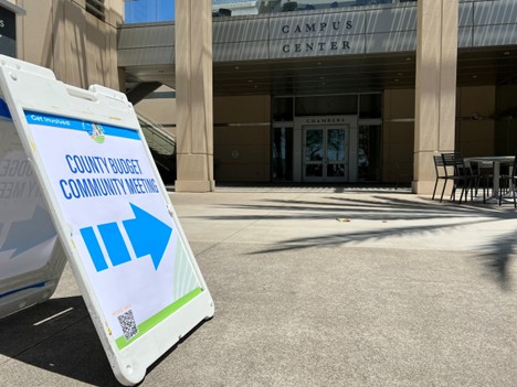 Photo of sign for Community Budget Hearing at County Operations Center