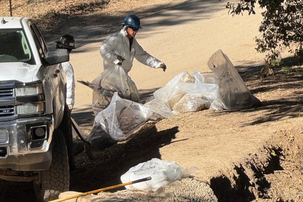 Crews are seen at the site of the oil spill a month after the incident. Credit: Courtesy of Ethan Higbee