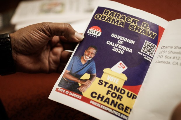 Barack D. Obama Shaw, 56, a local candidate for California governor from Alameda, shows his campaign flyer during an interview on May 5, 2026. (Dai Sugano/Bay Area News Group)