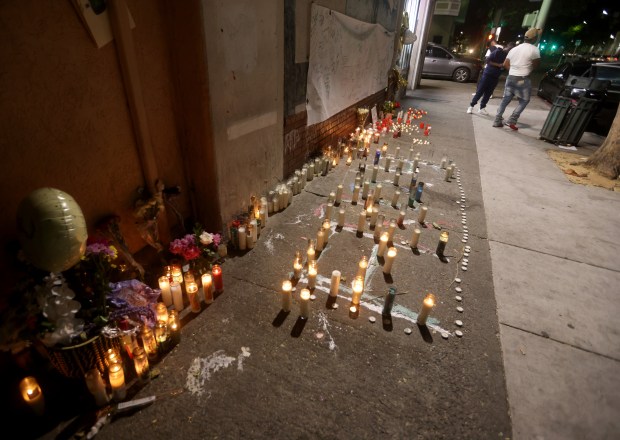 A memorial is seen on International Boulevard near 85th Avenue in Oakland, Calif., on Monday, May 18, 2026. Three people died when a speeding pickup truck crashed into a crowd of people in East Oakland late Saturday, authorities said. (Jane Tyska/Bay Area News Group)
