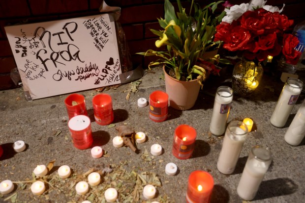 A memorial is seen on International Boulevard near 85th Avenue in Oakland, Calif., on Monday, May 18, 2026. Three people died when a speeding pickup truck crashed into a crowd of people in East Oakland late Saturday, authorities said. (Jane Tyska/Bay Area News Group)