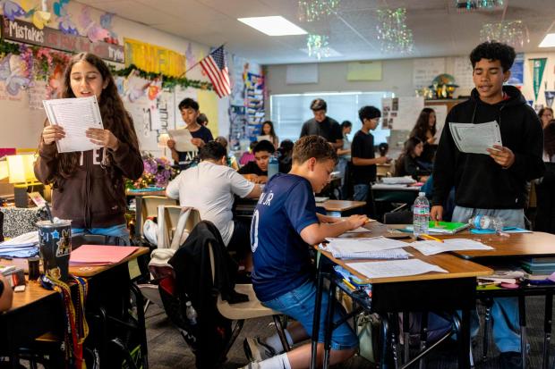 Sixth graders read a passage and give constructive feedback to their partners during Nancy Barajas' class at Fairview Elementary School on Wednesday, May 6, 2026, in Modesto, Calif. (AP Photo/Annie Barker)