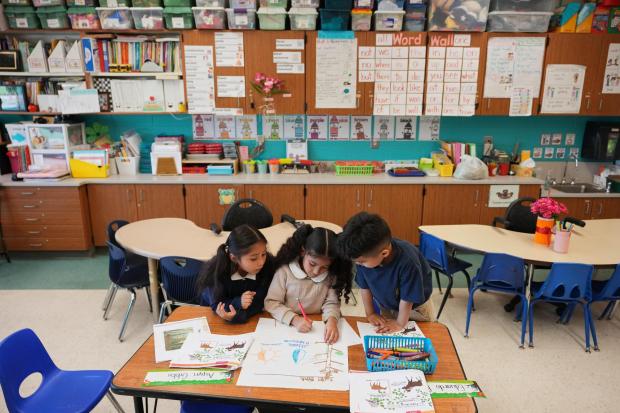 Kindergarten students work on a project at Munger Elementary-Middle School Thursday, May 7, 2026, in Detroit. (AP Photo/Paul Sancya)
