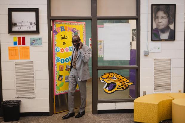Birmingham City Schools Superintendent, Dr. Mark A. Sullivan, takes a call as he enters the library at Oxmoor Valley Elementary School in Birmingham, Ala., Wednesday, May 6, 2026. (Will McLelland/AL.com via AP)