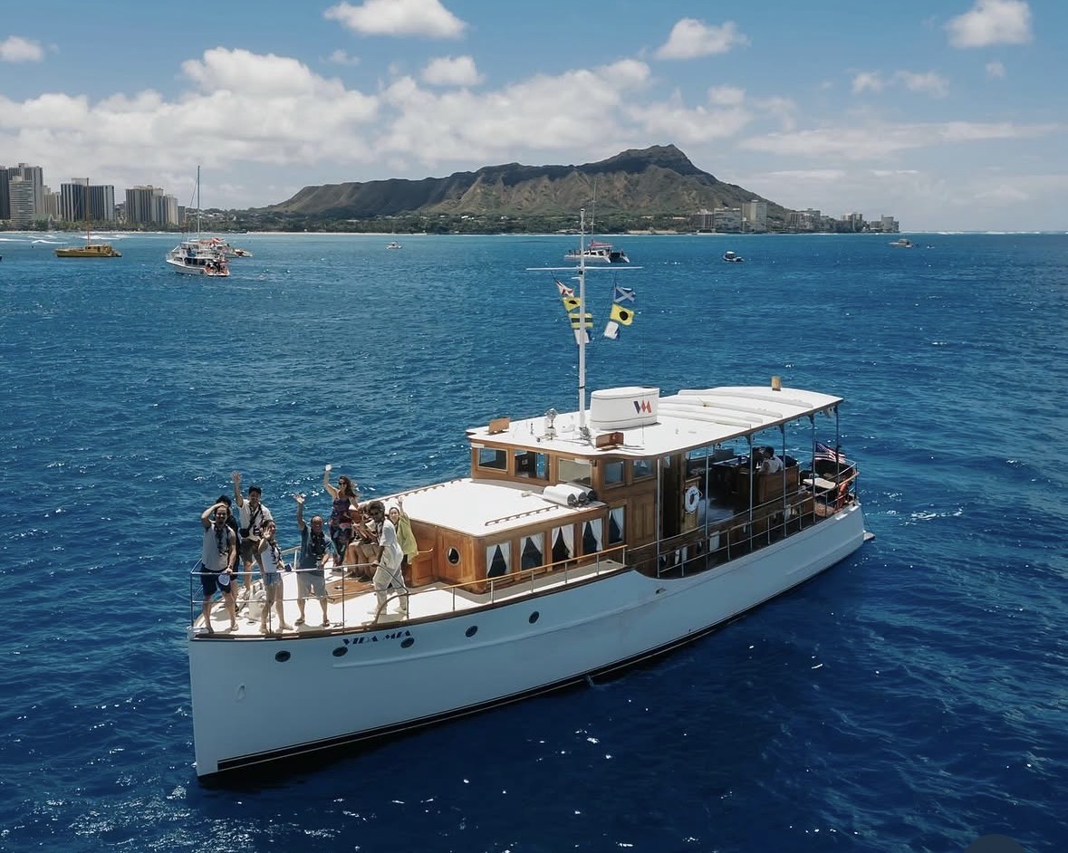 Vida Mia is an historic wooden power boat with local...