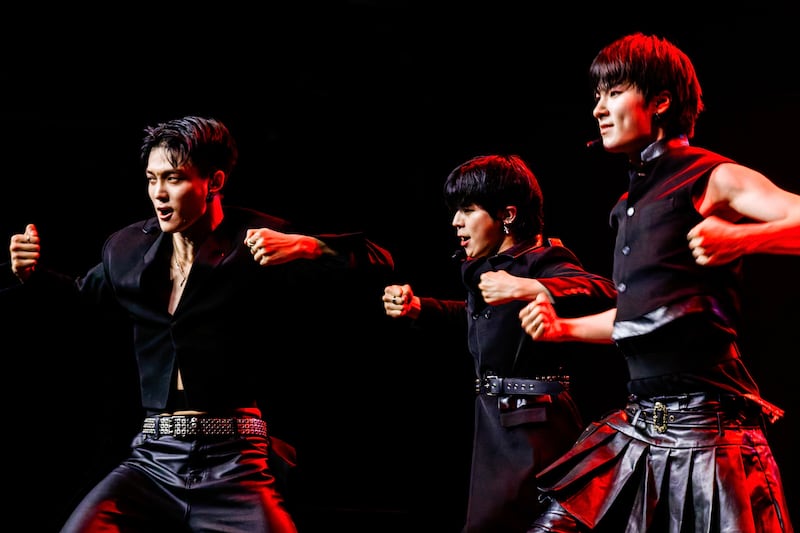 K-pop artists dancing on stage