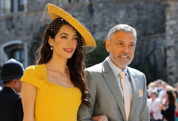 Amal Clooney and US actor George Clooney arrive for the wedding ceremony of Britain's Prince Harry, Duke of Sussex and US actress Meghan Markle at St George's Chapel, Windsor Castle, in Windsor, on May 19, 2018. (GARETH FULLER/AFP/Getty Images)