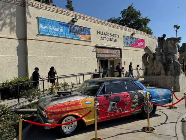 A low rider with custom art by Chaz Bojórquez is parked outside the Millard Sheets Art Center at the L.A. County Fair. Bojorquez and 62 other artists contributed to the exhibit "Play Pavilion: A Survey of Regional Creative Subcultures." (Photo by David Allen, Inland Valley Daily Bulletin/SCNG)