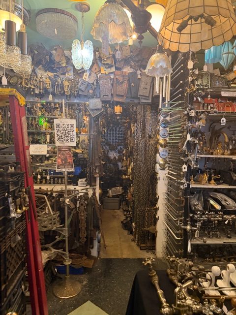 The Loft at Liz’s interior packed with antique fixtures lighting and industrial art materials