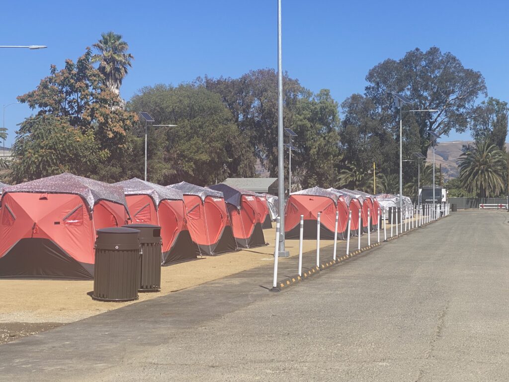 A row of tents at a sanctioned homeless encampment in San Jose, California