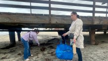 Volunteers with the Surfrider Foundation pickup trash and debris, Saturday, on Imperial Beach, May 16, 2026.
