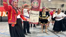 The Peruvian delegation warns up before the community procession at the multicultural mass held Saturday, May 23, 2026.