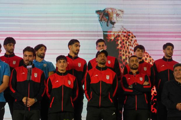 Iran's national soccer team players stand onstage in Tehran.