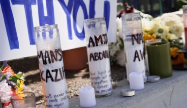 Candles with victims names are placed outside the Islamic Center of San Diego in the aftermath of a shooting on Wednesday, May 20, 2026, in San Diego. (AP Photo/Ty Oneil)