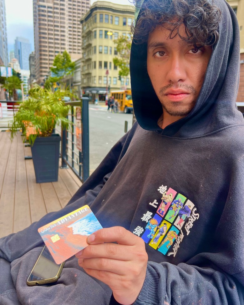 Man holds his CalFresh card