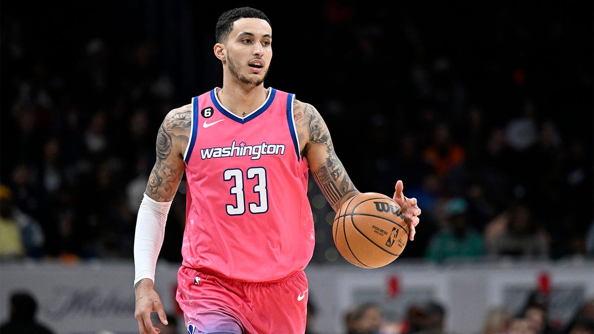 Kyle Kuzma dribbling basketball during game at Capital One Arena