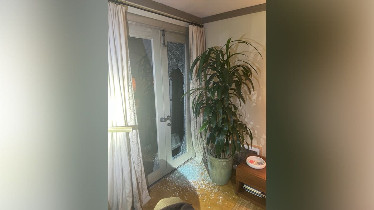 Broken glass door inside a home following an alleged residential burglary in Los Angeles County.