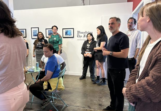 Chris Heiser (R, in black) speaks at the opening of the exhibition "Visualizing the Future" at North Figueroa Bookshop on May 9, 2026. (Photo by Erik Pedersen/SCNG)