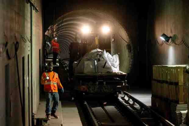 FILE- A construction car is moved along the tracks of the Metro D (Purple) Line beneath Wilshire Boulevard in Los Angeles on Tuesday, April 2, 2024. Metro has completed the tunneling of the D (Purple) Line Subway Extension Project connecting downtown and West L.A. (Photo by Sarah Reingewirtz, Los Angeles Daily News/SCNG)