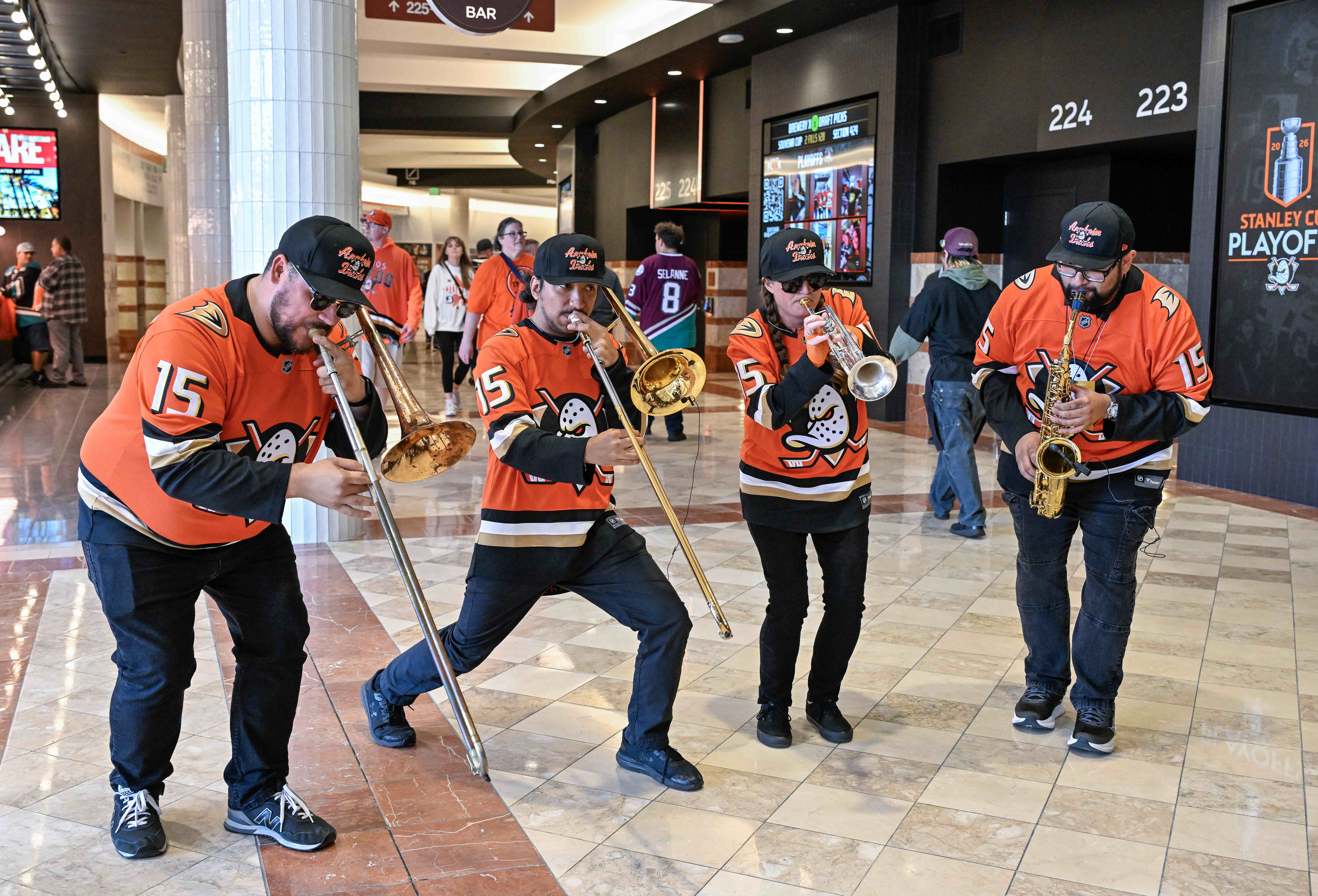 Members of Bear Brass perform for fans on their way...